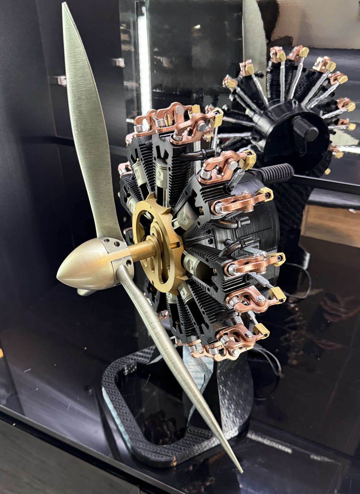 Aero Mécanique R9 — three-quarter editorial view in vitrine